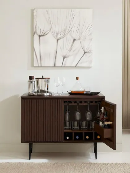 Clean, elegant, and functional. This shot of a slatted bar cabinet shows my approach to classic furniture photography. The focus is on the product's design, material, and utility, presented in a beautifully styled yet straightforward context for catalog and e-commerce use.