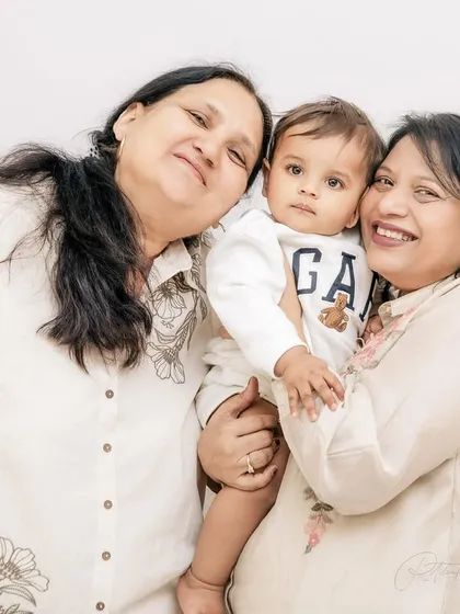 Three generations of love in one photograph. The warmth and affection shared between this baby, his mother, and his grandmother is a beautiful memory from his first birthday shoot.