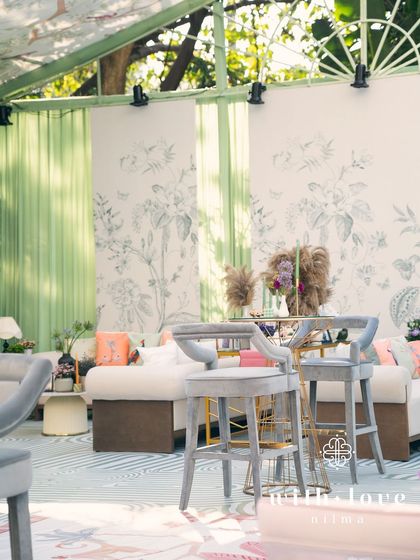 A wide view of 'The Conservatory' lounge area, showing the spacious and stylish layout.