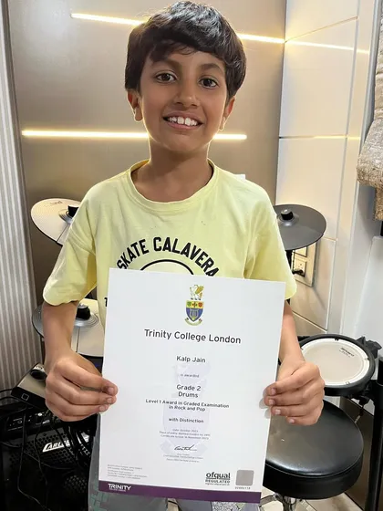 Our student Kalp proudly displays his Grade 2 Drums certificate, which he passed with Distinction. We are deeply humbled by our students' stupendous achievements.