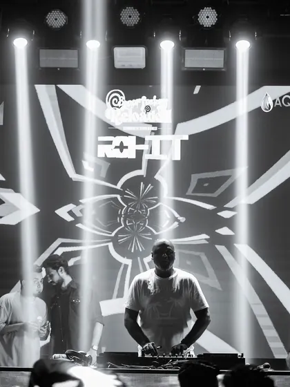A black and white shot of me at the console, silhouetted by the stage lights.