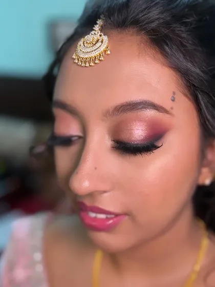 A close-up of Nasreen's stunning eye makeup. The blend of shimmer and matte pinks creates a beautiful, multi-dimensional look.