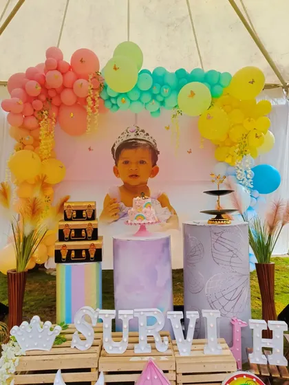 The complete outdoor party setup for Survi, including props and personalized letters.