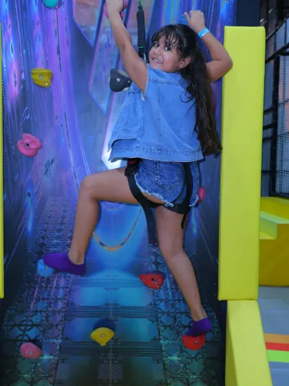 Conquering the wall one grip at a time! Our rock climbing wall offers a fantastic challenge for kids, helping build confidence and strength in a fully supervised and secure setting.