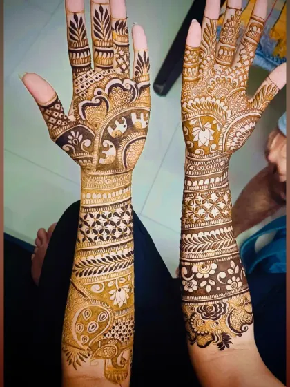 This is a classic example of my traditional bridal work. It features auspicious elephant motifs for good luck and prosperity, along with intricate jaali patterns and floral vines covering the hands and forearms.