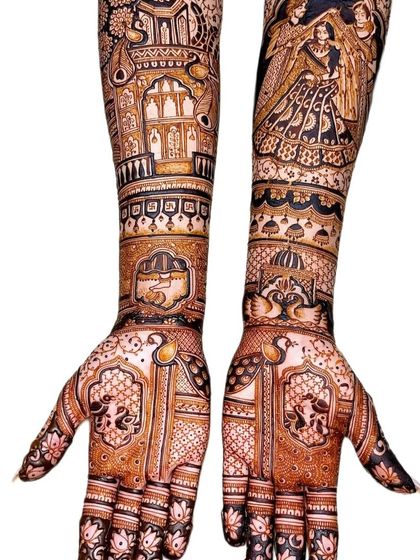 A very detailed design with peacocks, jharokhas (windows), and a family portrait, showcasing the richness of traditional art.