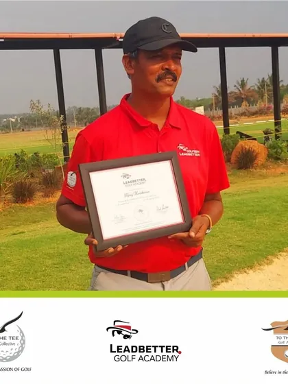 Our coach, Ajay Krishnan, proudly holding his Leadbetter Golf Academy certification at our practice facility.