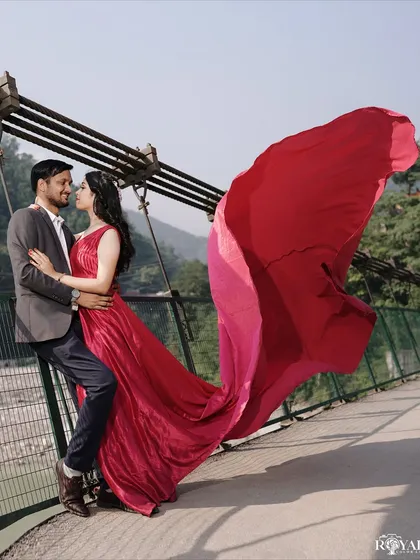 A dramatic pre-wedding portrait on one of Rishikesh's iconic bridges. We create cinematic, magazine-worthy images that tell your epic love story.