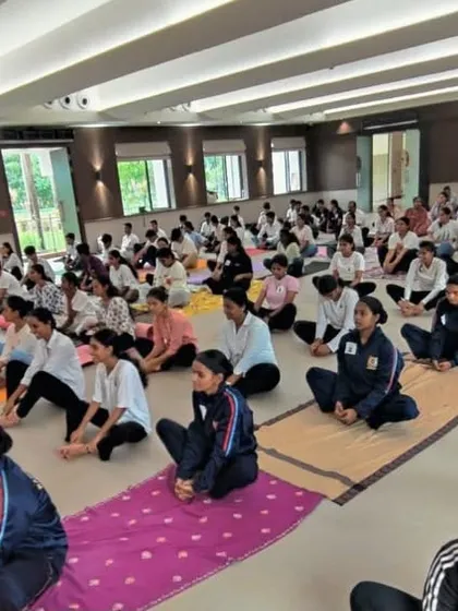 Conducting a yoga session for college students. Instilling the values of mindfulness and self-care at a young age is crucial for building a generation of balanced and resilient individuals.