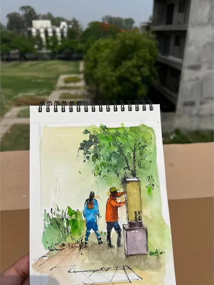 My sketchbook with the "People at Work" painting, held up against the backdrop of my neighborhood.