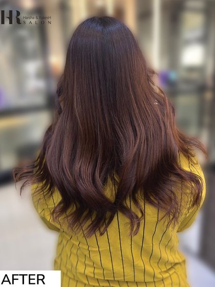 The after result is a beautiful, rich chocolate brown global color, styled into soft, bouncy waves.
