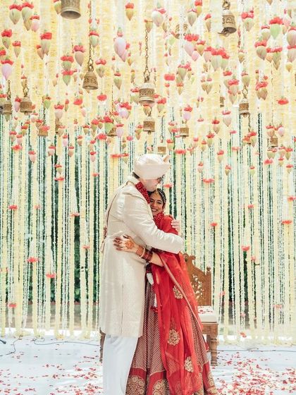 A duplicate of 302, capturing a sweet embrace under a floral canopy.