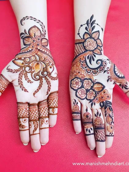 A stunning example of two different yet complementary designs on each hand. One hand has a bold Arabic style, while the other features more traditional Indian floral patterns.