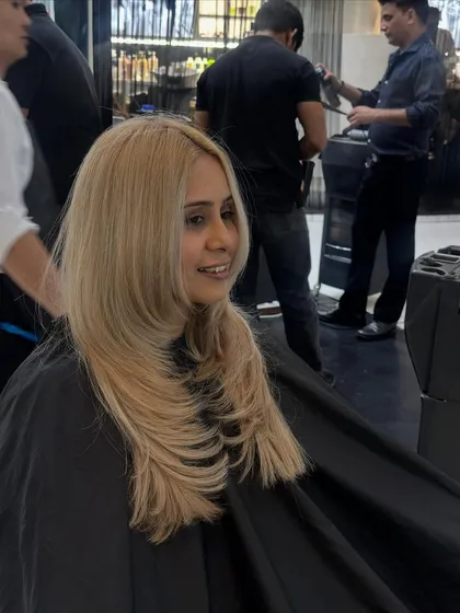 This sleek, straight style really shows off the clean lines of this blonde color and cut. A flat iron and heat protectant are key for this look.