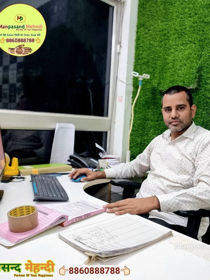 A photo of me in my new office, ready to take your bookings and answer your questions.