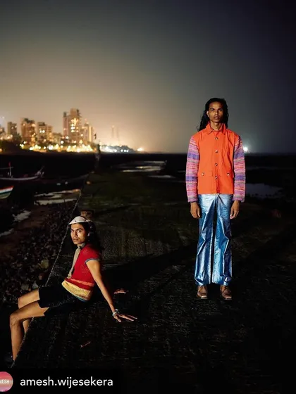 Another dynamic shot from the Amesh editorial, with the Mumbai skyline in the background. My grooming work ensures the models look sharp and defined, even in a complex, low-light environment.