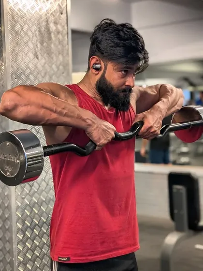 Building powerful shoulders and traps with a focused upright row. This exercise is key for developing that complete, well-rounded upper body physique.