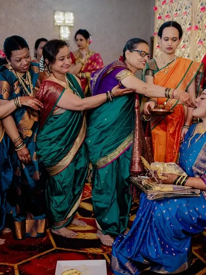 A beautiful Maharashtrian wedding ritual where married women bless the bride.