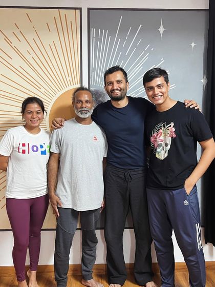 A candid moment of connection between our instructors and students after a class. These small moments of shared joy are at the heart of our community.