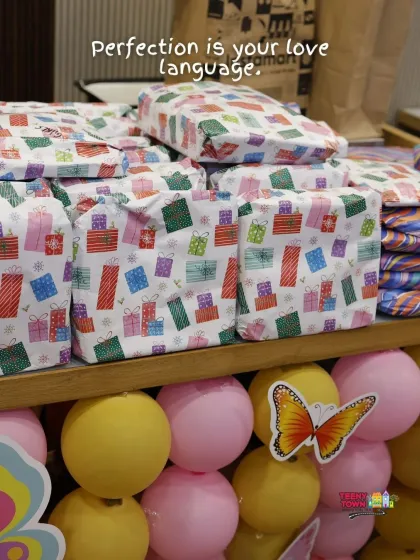 Perfectly wrapped return gifts that match the butterfly party theme, showing how I coordinate every last detail.