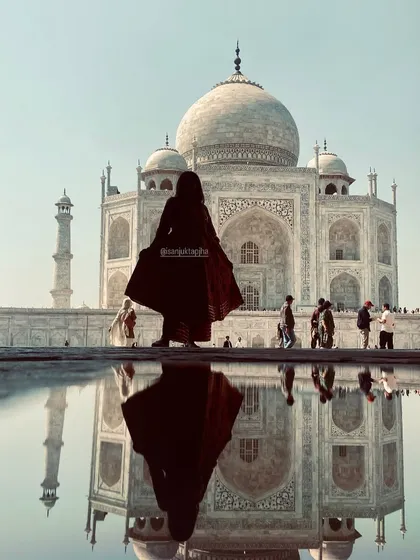 Creating stunning visuals at iconic locations like the Taj Mahal is part of my travel content. This shot shows my ability to blend fashion with breathtaking scenery, creating powerful, shareable images.