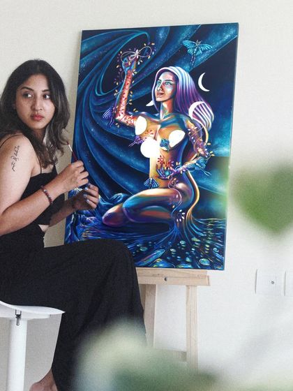 This piece is about the joy of creating your own reality. A soul in the form of a woman joyfully plucks planets from the sky, embracing her power to shape her world. It’s a reminder to find the fun in living.