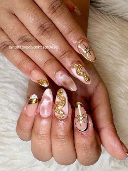 Another angle of the celestial 3D gold snake set, showing off the beautiful almond shape and the way the different elements work together to create a cohesive, high-fashion look.