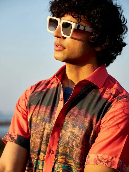 The Zoop collection unveils a fiery red linen creation. This printed shirt is a masterful blend of boldness and breathability, perfect for making a statement.