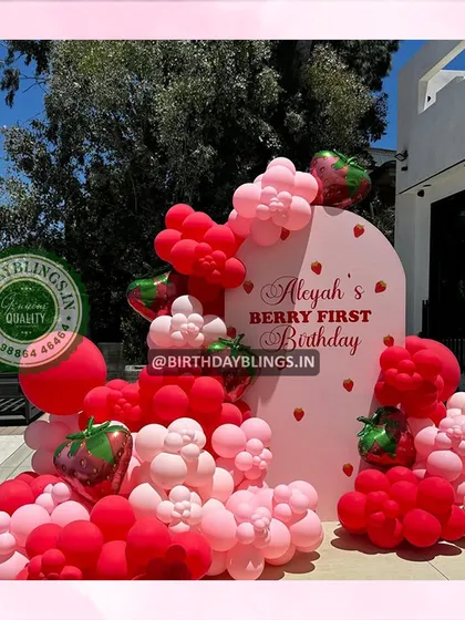 An outdoor setup for a "Berry First Birthday," showing how the vibrant colors pop in the sunlight.
