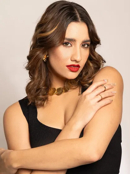 A final portrait from this series, capturing the confidence and elegance that a classic red lip and perfectly styled hair can bring.