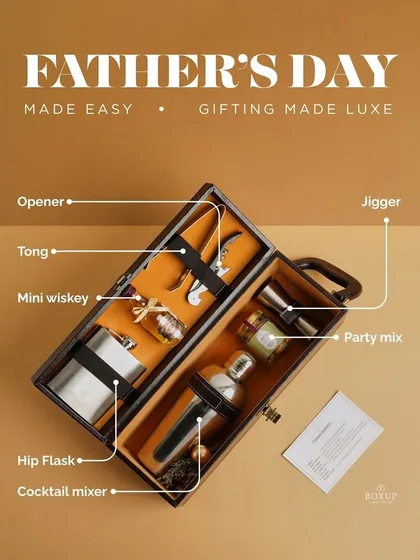 A look inside the 'Gentleman's Pour' hamper, a sophisticated bar essentials kit perfect for the groom's party or as a thank you gift for fathers. It includes a hip flask, cocktail mixer, and other bar accessories.
