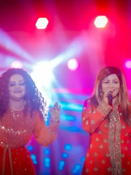 Singing together under the bright red and blue lights. The atmosphere at our live shows is always electric.