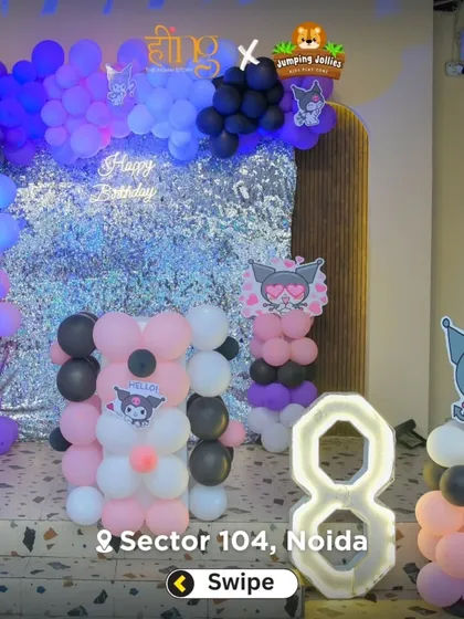 The setup for an 8th birthday with a Kuromi theme, featuring character cutouts, a silver sequin backdrop, and balloon sculptures in the theme's colors.