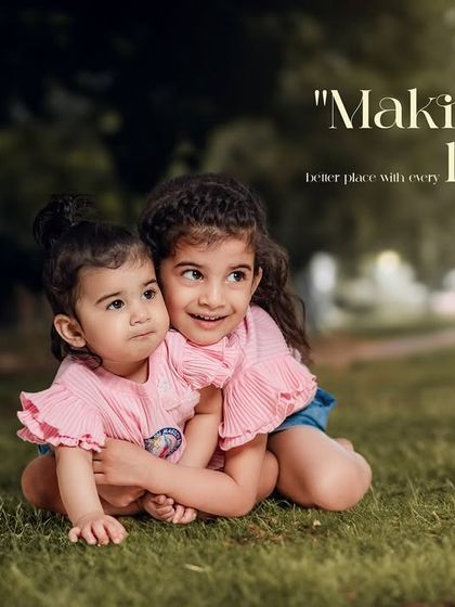 Making the world a better place with every laugh. A sweet portrait of two sisters sharing a hug on the grass during an outdoor session.