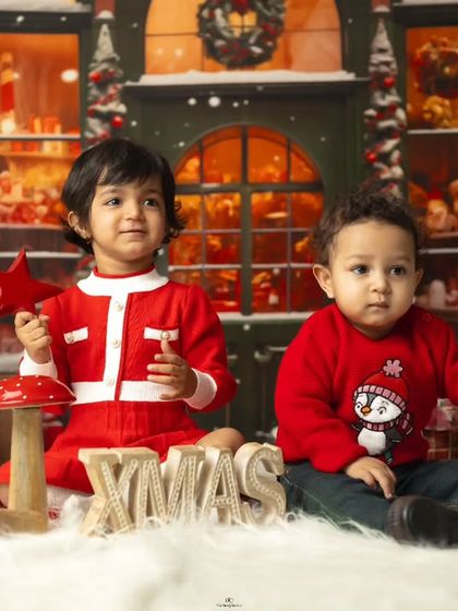 Siblings enjoying our festive Christmas setup. Holiday-themed shoots are a wonderful way to create memories and annual family traditions.