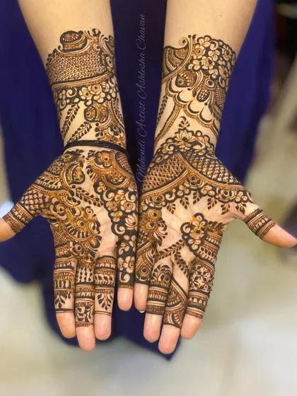 A classic Indo-Arabic design with a mix of floral and paisley motifs. The patterns are intricate and create a rich, textured look.