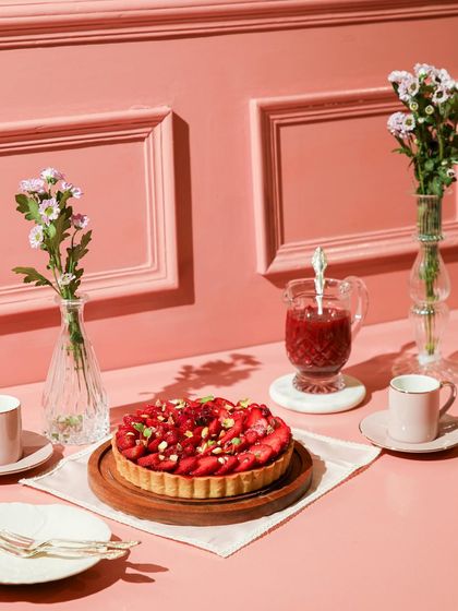 Berry blossoms in a bite! Our strawberry tart is the star of this elegant pink-themed dessert table.
