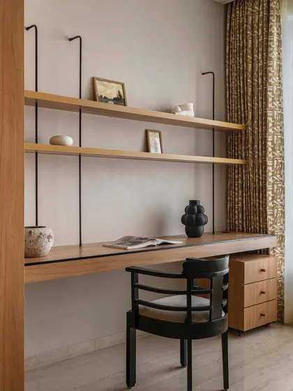 Another angle of the minimalist study in Apartment 3201. The suspended shelving and warm oak wood create an open, airy workspace that feels uncluttered and conducive to focus, reflecting our belief in beautiful, functional design.