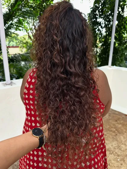 Once you embrace your curls, you never go back. For her new job, we did a haircut to reshape her curls and added highlights to make them stand out.