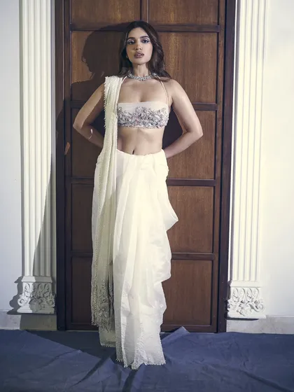 The full silhouette of this unique draped saree look. It’s a perfect example of contemporary Indian couture.