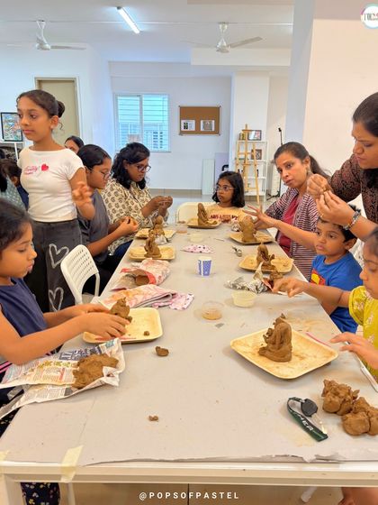 Our instructors provide hands-on help, guiding participants through the steps of molding and shaping their clay Ganeshas.