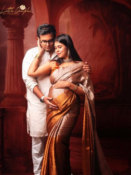 The warmth and intimacy of a couple's bond shines through in this traditional maternity photoshoot. The way they look at each other tells a beautiful story of love.