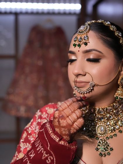 A close-up of the bride's makeup. The soft smokey eye and perfectly defined nath add to the traditional yet modern feel of the look.