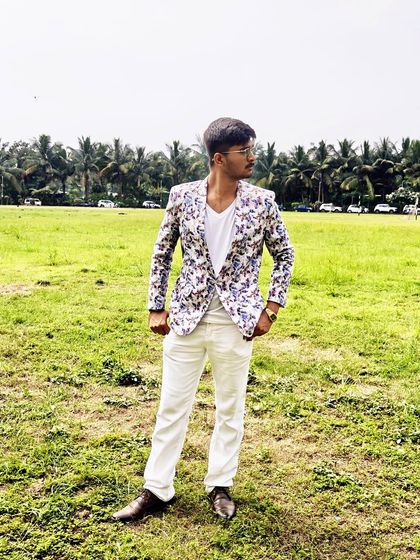 This client is rocking our floral print blazer, perfect for a daytime event or a fun party. It's a stylish choice that shows you don't have to spend a lot to have a unique look.