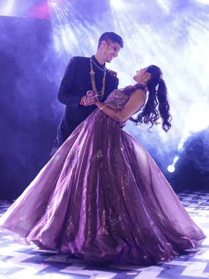 Capturing the pure joy of a Sangeet night. This shot is all about the connection between the couple, lost in their dance under the spotlights. It's these unscripted, emotional moments that make event photography so special.