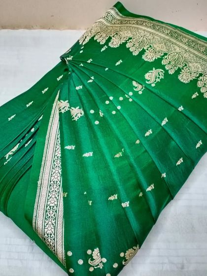 This green Banarasi saree is pre-pleated and ready to wear. My service ensures that even the most luxurious sarees are easy to manage.