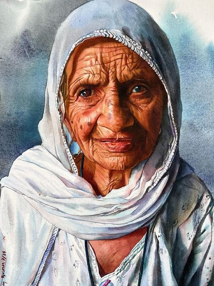 The final version of a portrait from my complete watercolor course. The cool blue of the headscarf and the soft, out-of-focus background help to frame her face and expression.