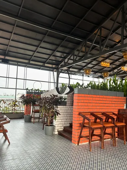 Exposed brick and potted plants are a classic combination. At The Soda Factory, we used large foliage plants in grey planters to soften the industrial look of the brick and tile work.