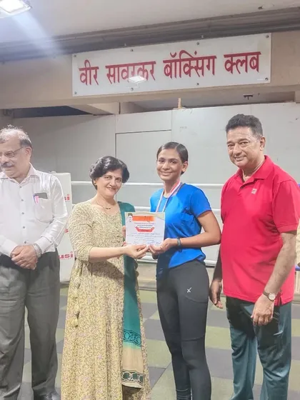 Our silver medalist receiving her certificate and medal. Every competition is a valuable experience.
