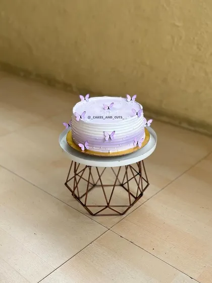 Another view of the purple butterfly cake, showing the ombre frosting effect.